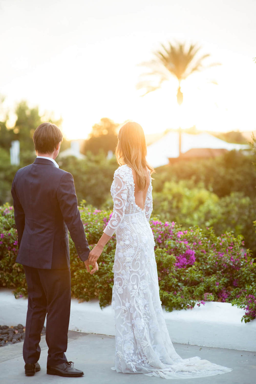 bride groom sunset palm tree holding hands