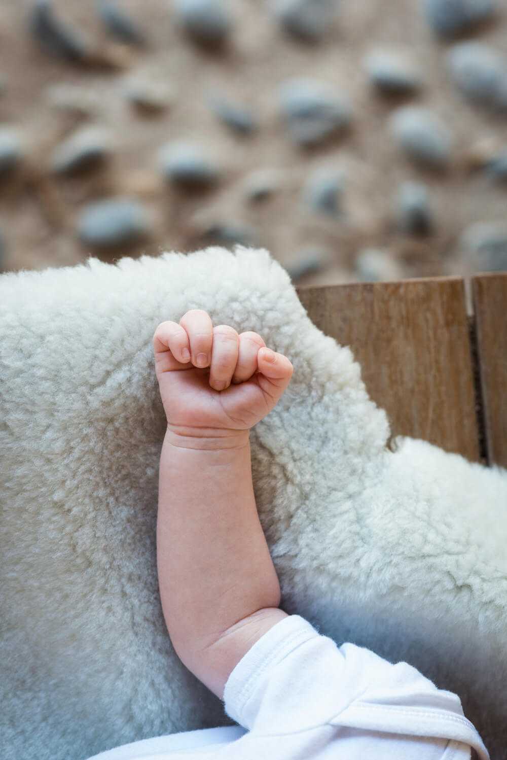 a closed fist of a newborn baby