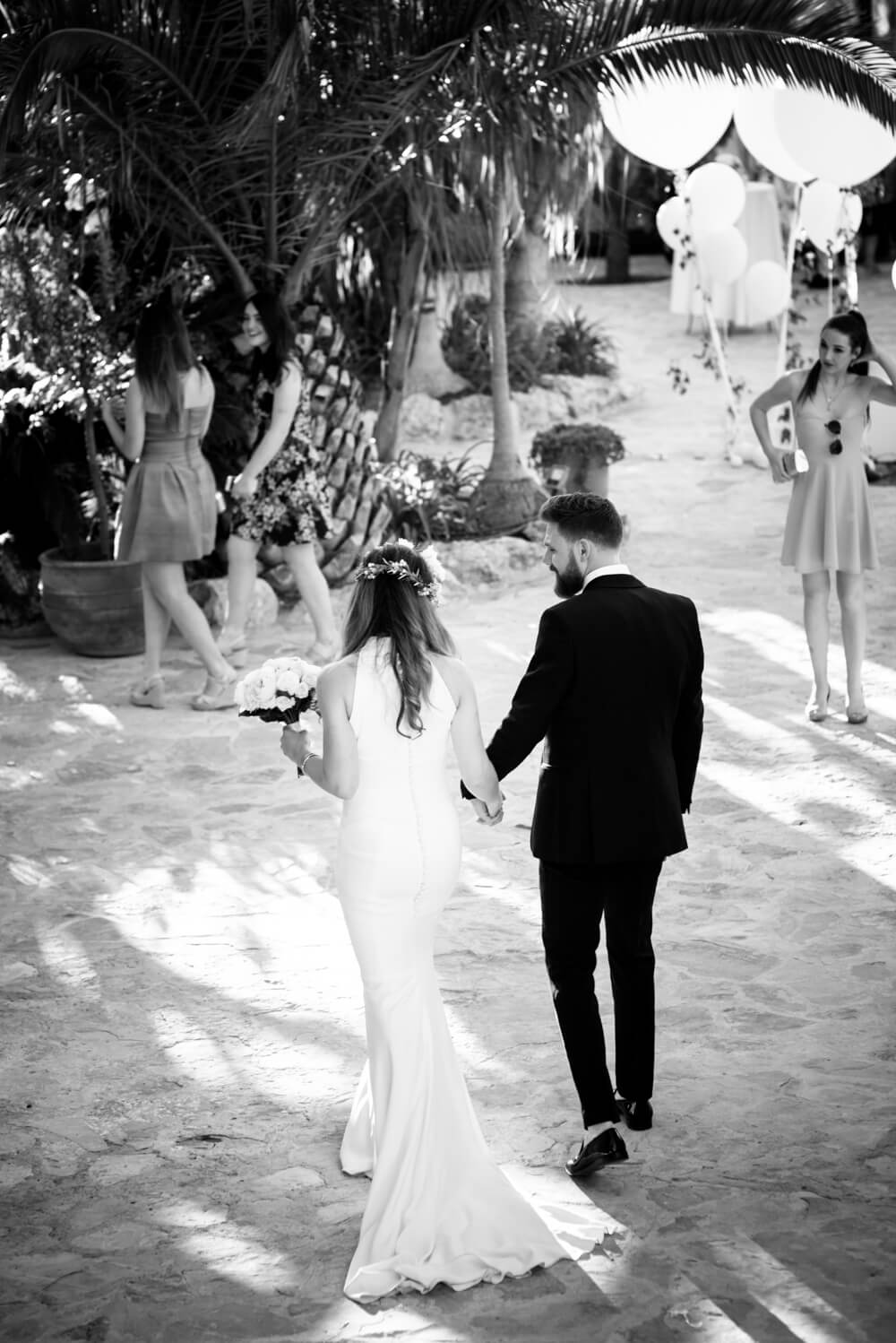 black and white photograph of a couple from behind at their wedding in Ibiza