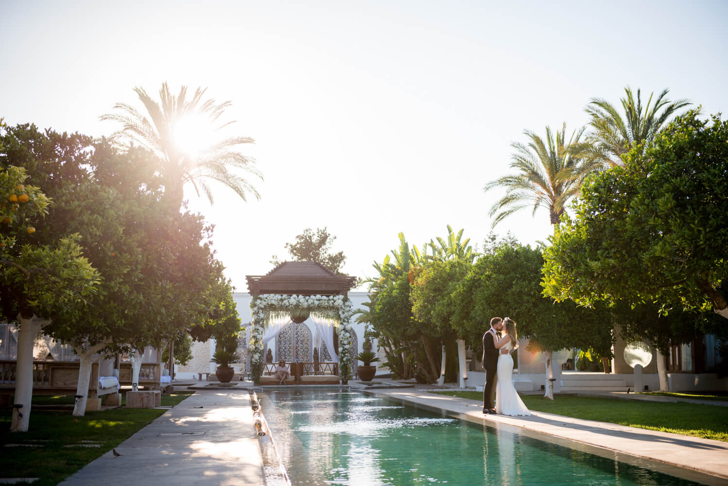 Bride and Groom by Spa pool at Atzaro during couple shoot on their wedding day