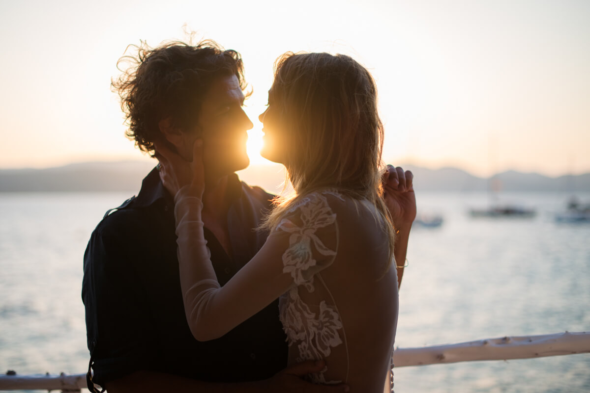 Bride and groom kissing at sunset at their Ibiza wedding