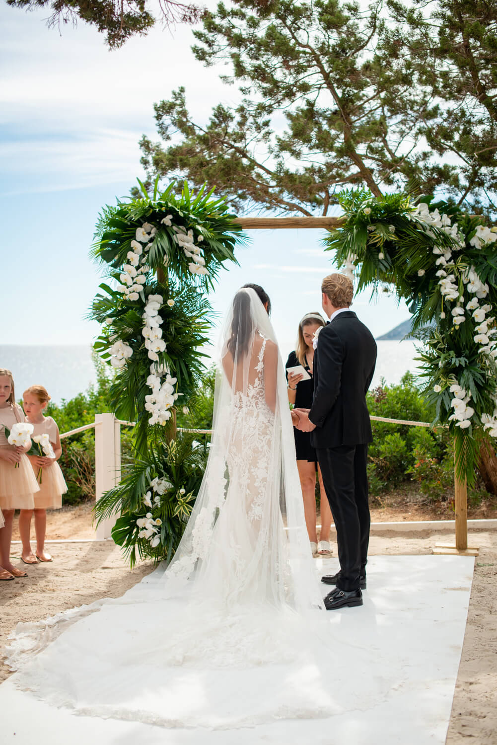 Bride and groom at Nikki beach, Ibiza at the altar