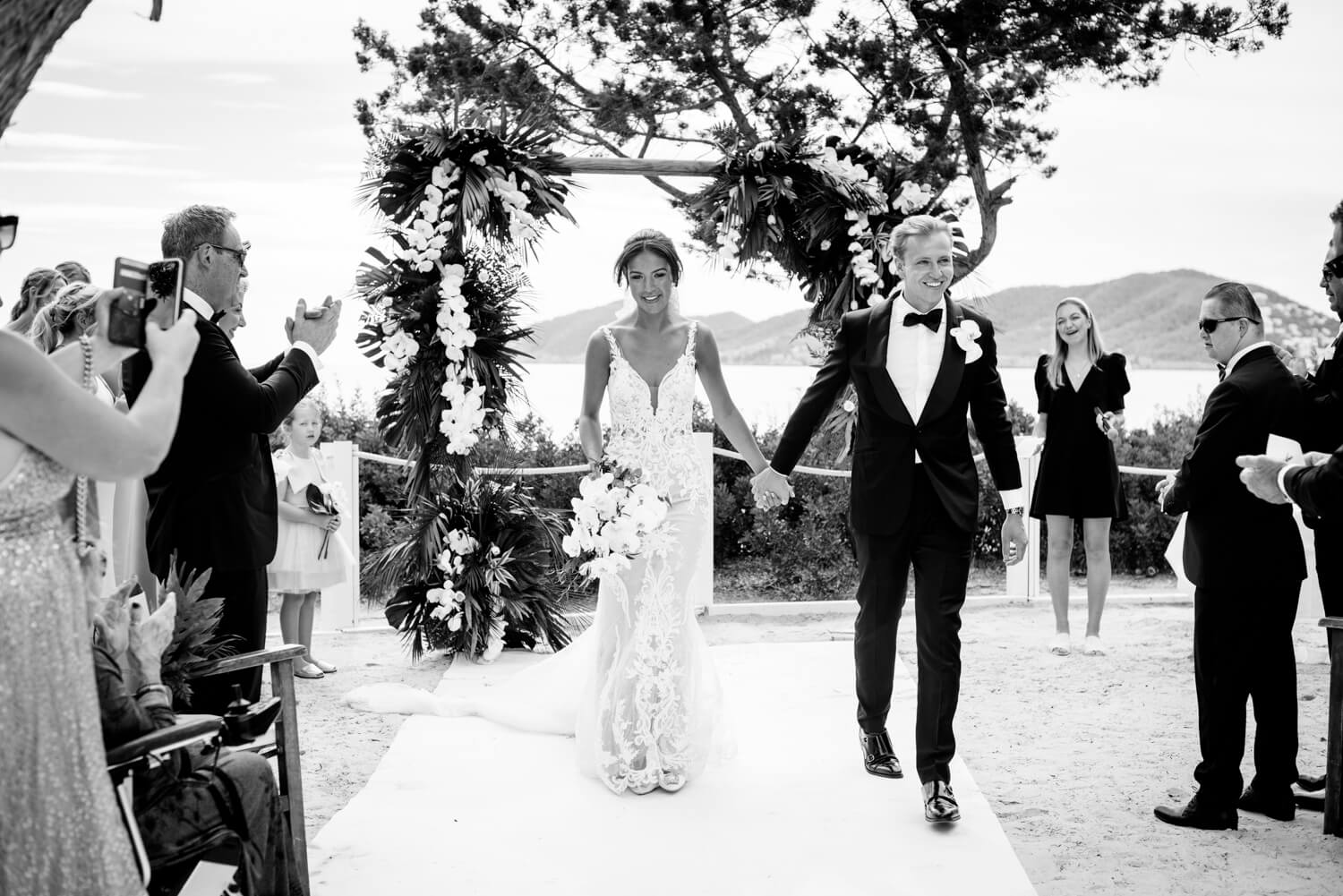 Monochrome - BnW bride and groom at Nikki beach, Ibiza just married