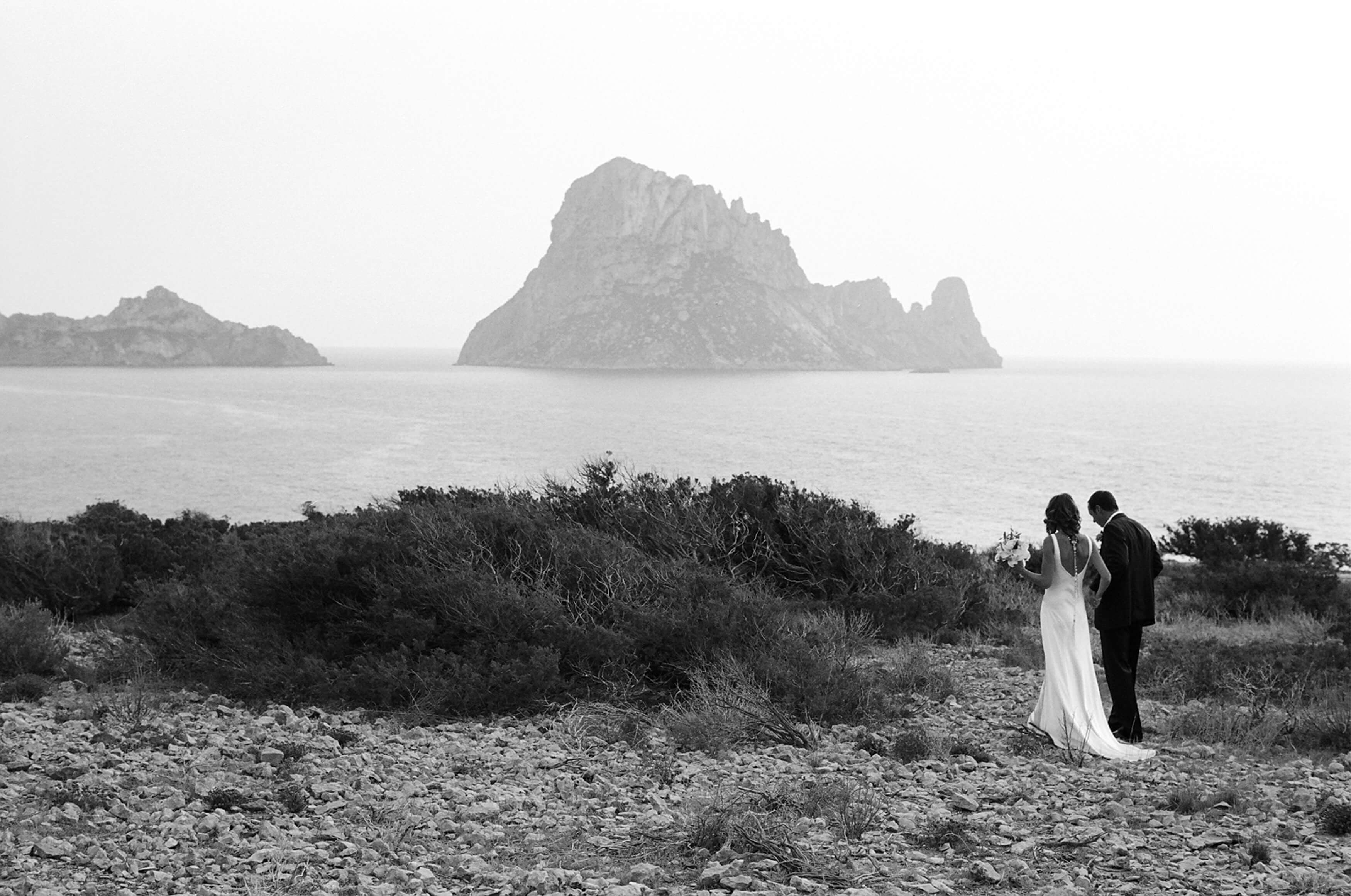 Bride and Groom on Ibiza wedding over looking Es Vedra Black and White analofg photo