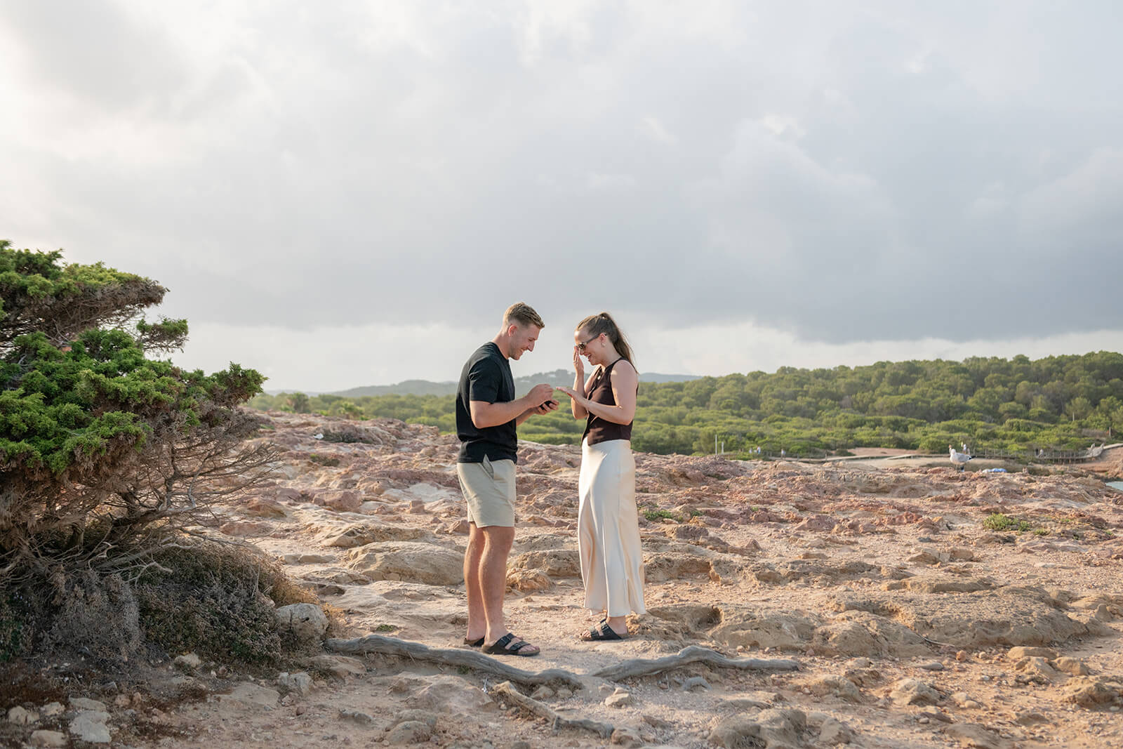 C+M _ Gypsy Westwood HL-8_websize Couple stand holding hands after marriage proposal on the cliffs of Ibiza